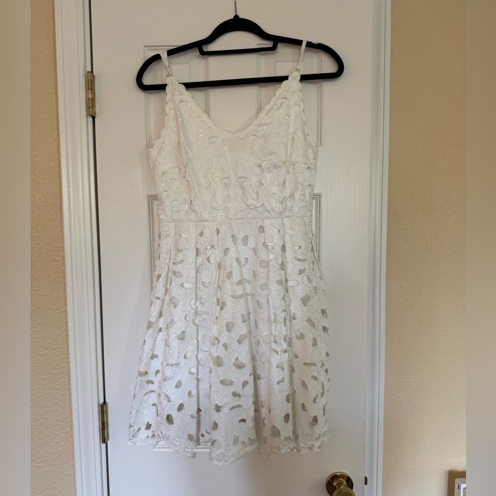 Lucy Paris white dress. Never worn- with tags.  Size Small
